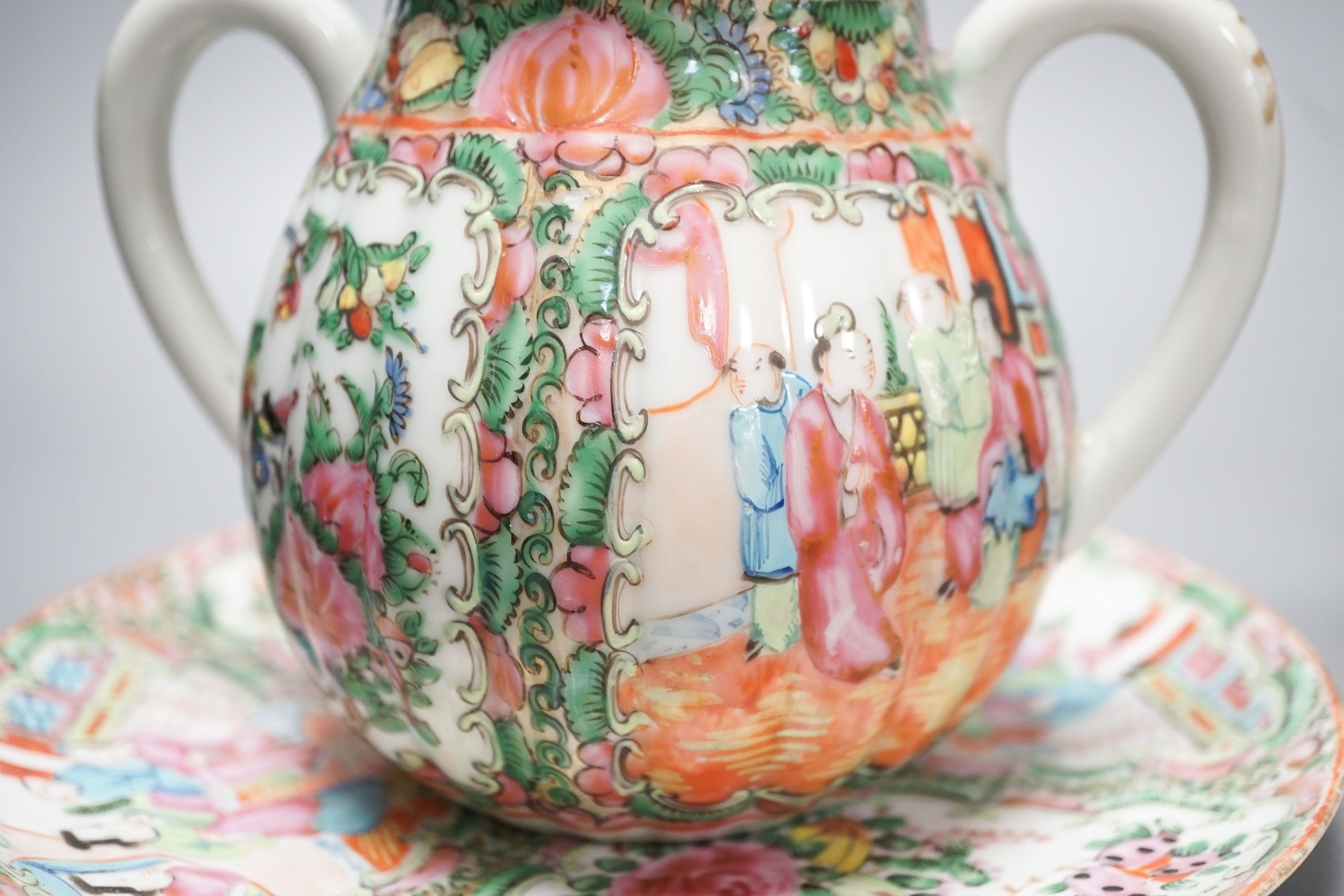 A 19th century Chinese famille rose teapot, sugar bowl, saucer dish vase and a similar yellow ground ‘dragon’ vase and cover 21cm